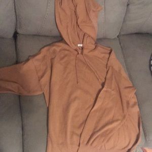 Brown/Orange colored hoodie. Size Large in Women’s. Worn once. In Good Condition